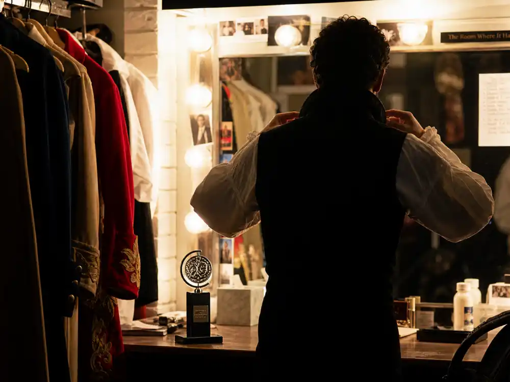 Broadway dressing room with costumes representing lead and featured acting Tony Awards categories explained for plays and musicals