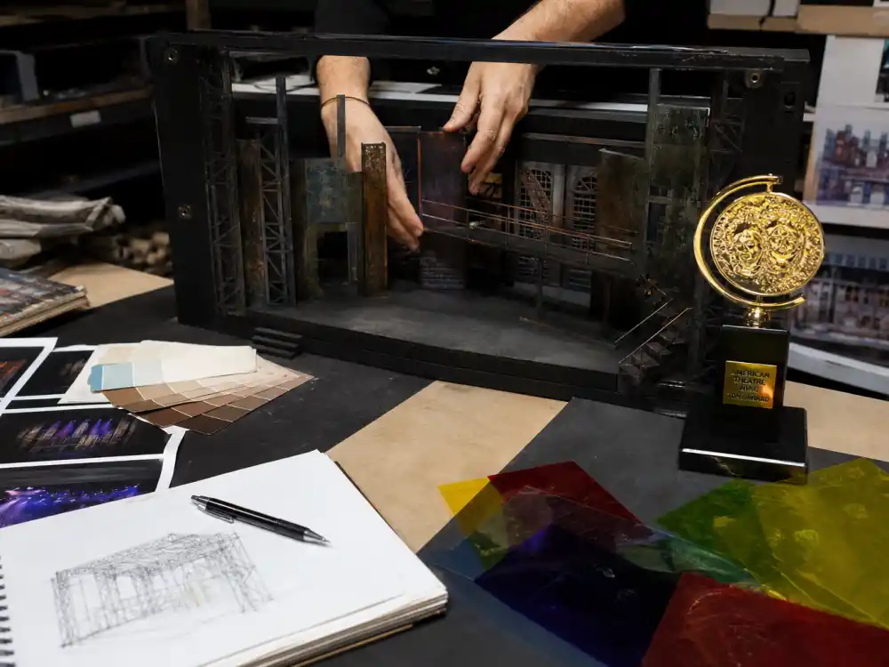 Scenic design workshop with stage model showing design Tony Awards categories explained for scenic costume lighting and sound prizes