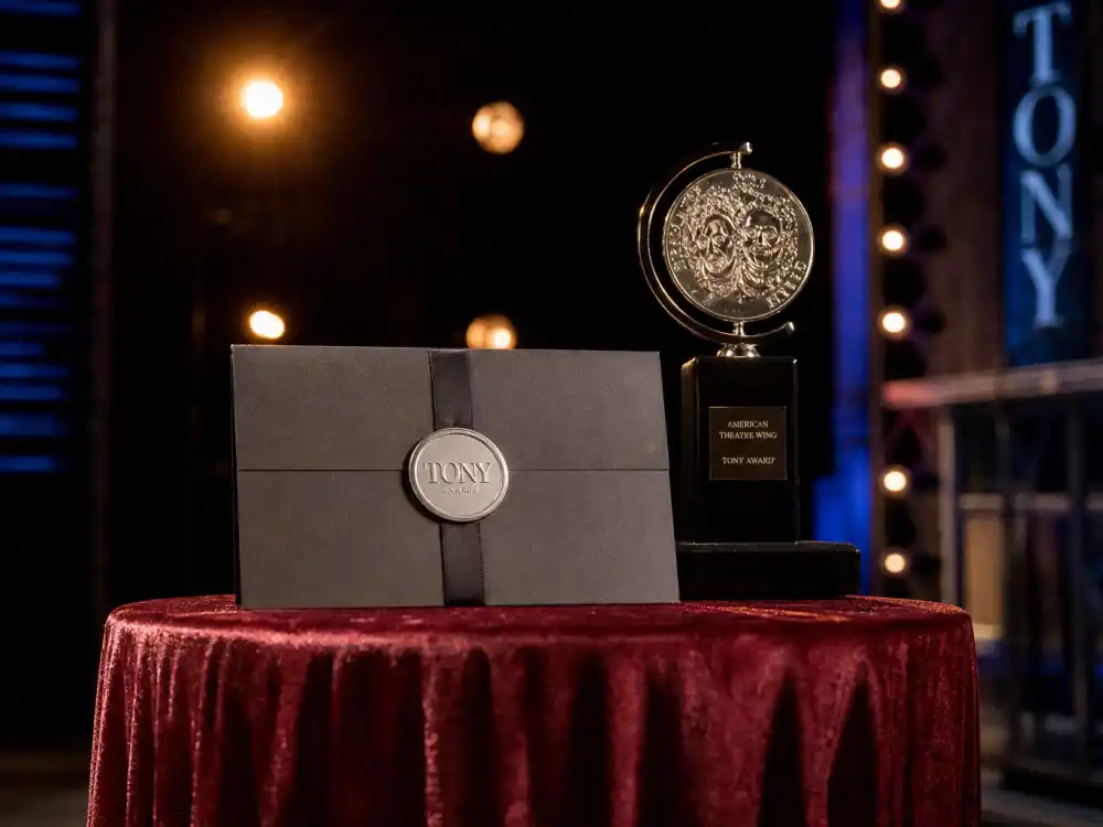 Sealed Tony Awards envelope on velvet podium evokes ceremony moments that add to the most Tony Awards won by a show totals each season