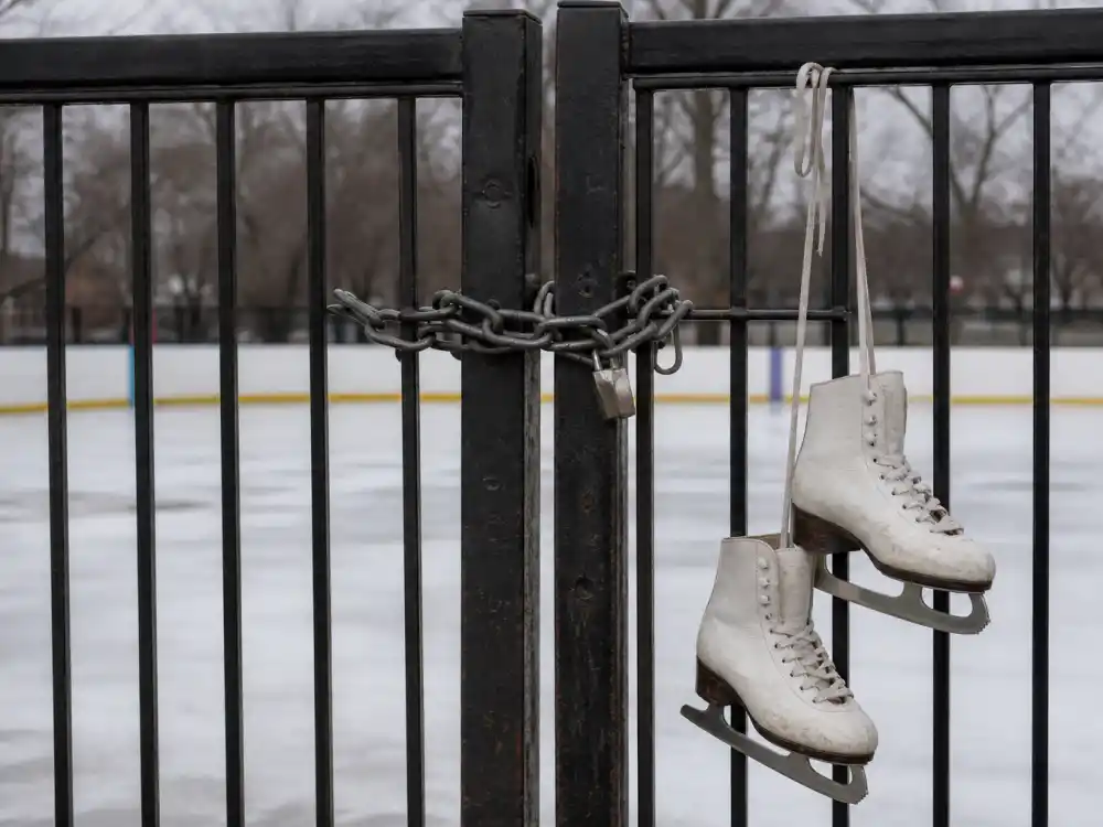 Locked ice rink gate with figure skates for Tonya Harding lifetime skating ban aftermath