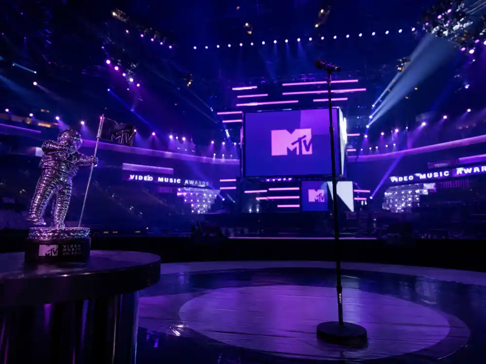 MTV VMA arena stage spotlights and microphone where artists chase the most VMAs won by an artist each September