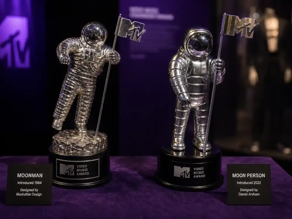 Moonman versus Moon Person side by side for VMA Moon Person trophy history — classic and modern MTV statuette designs on display