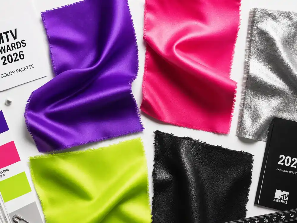 Electric purple hot pink silver metallic neon lime and black leather fabric swatches flat lay illustrating 2026 color palette trends in vmas celebrity outfits 2026