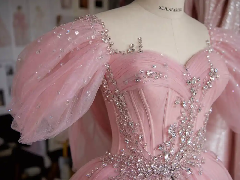 Custom Schiaparelli pale pink couture with crystal details central to what did Ariana Grande wear to Oscars 2024 Glinda moment