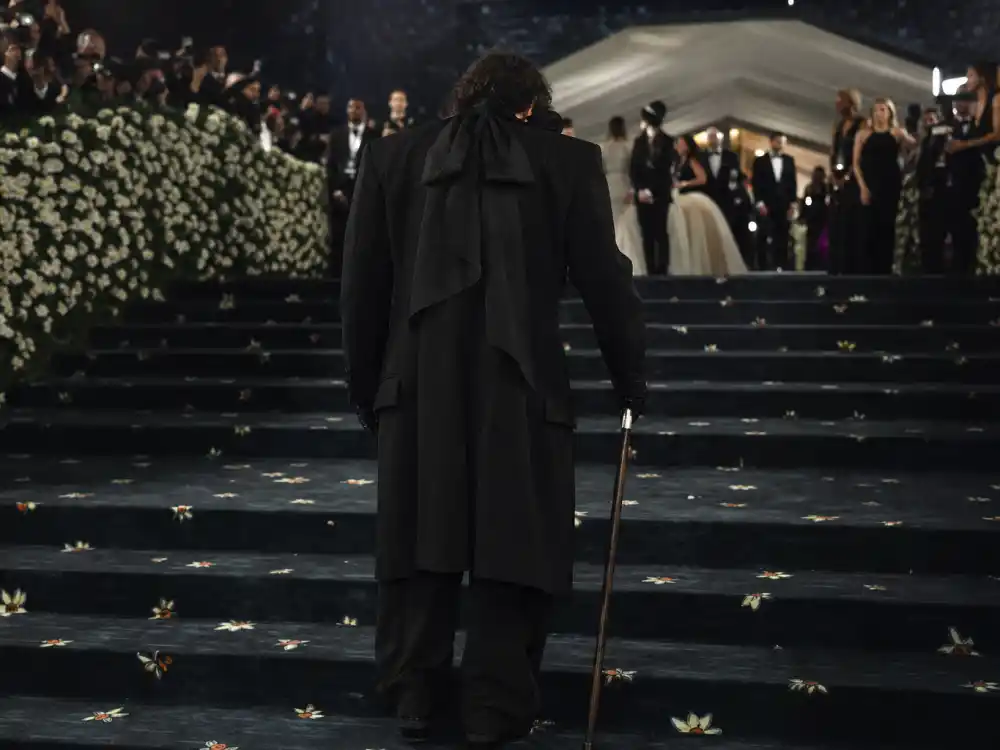 Custom Zara all-black tuxedo with pussy bow and cane closing what did Bad Bunny wear to Met Gala 2026 aged transformation
