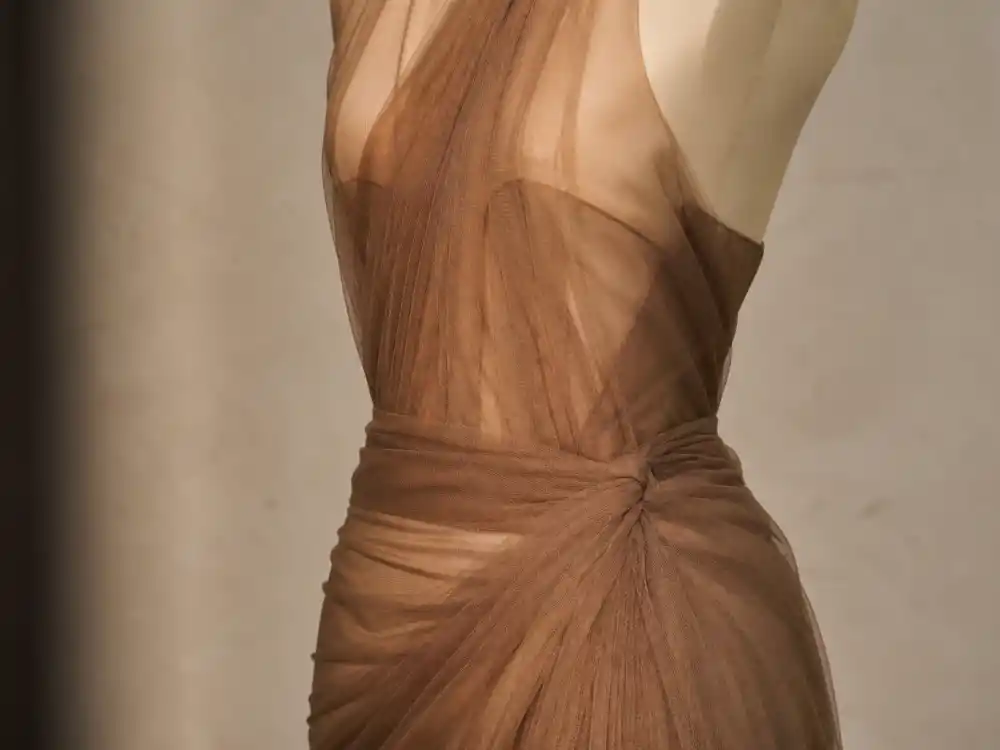 Sheer latte-brown Saint Laurent hosiery dress defining what did Bella Hadid wear to Cannes naked dressing era 2024