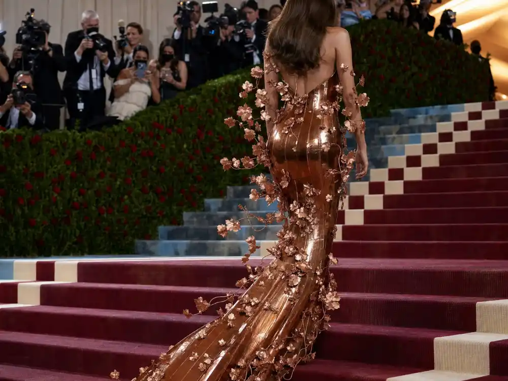 2022 Met Gala museum steps copper column gown mid-transformation answering what did Blake Lively wear to Met Gala Versace arrival