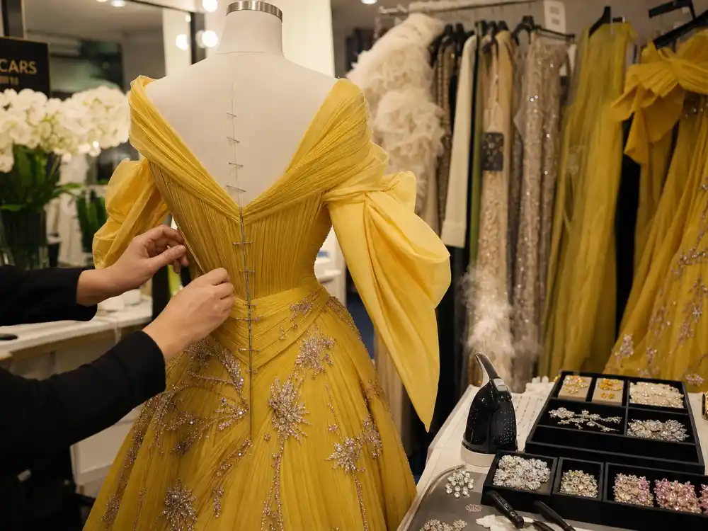 Couture fitting room prep behind what did Emma Stone wear to Oscars custom Louis Vuitton construction