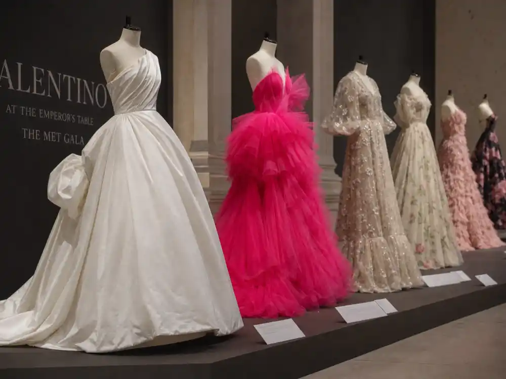 Row of dramatic Valentino evening gowns illustrating what did Florence Pugh wear to Met Gala and adjacent couture moments