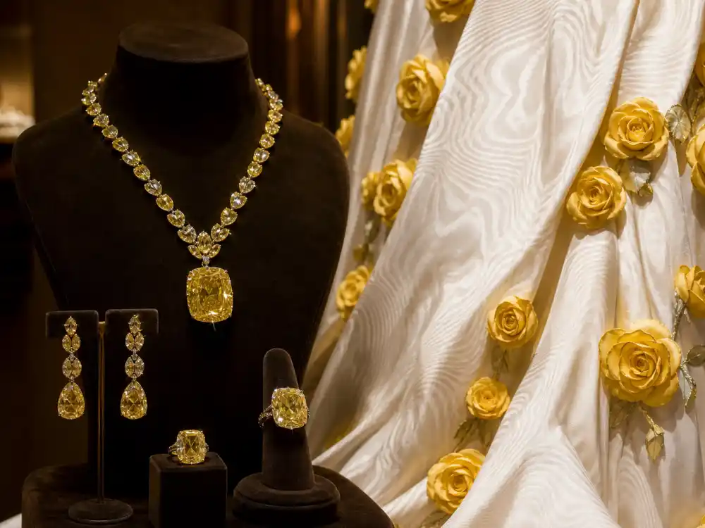 Chopard yellow diamond necklace and rings punctuating what did Gigi Hadid wear to Met Gala 2024 Thom Browne garden accessorizing