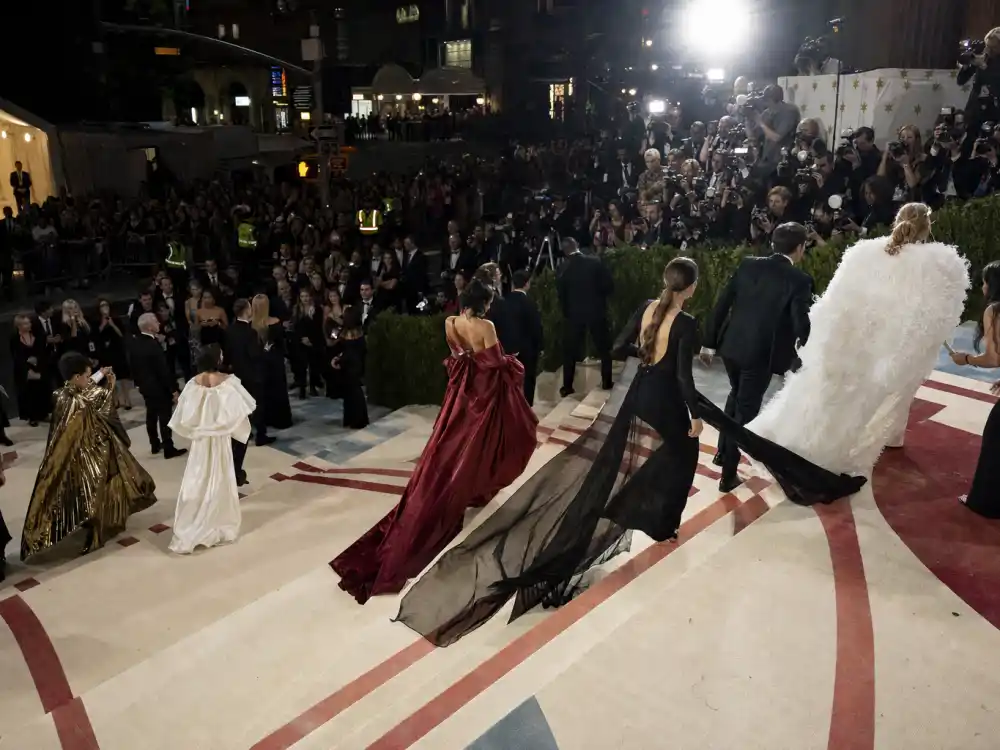 Met Gala red carpet arrivals from Thom Browne roses to Versace puffer coats illustrating what did Gigi Hadid wear to Met Gala across years
