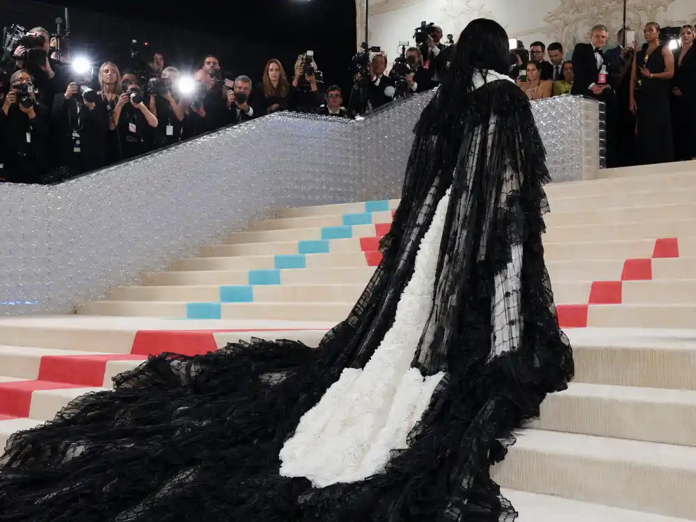 2023 Met Gala museum steps with gothic black and white couture train answering what did Jenna Ortega wear to Met Gala Thom Browne night