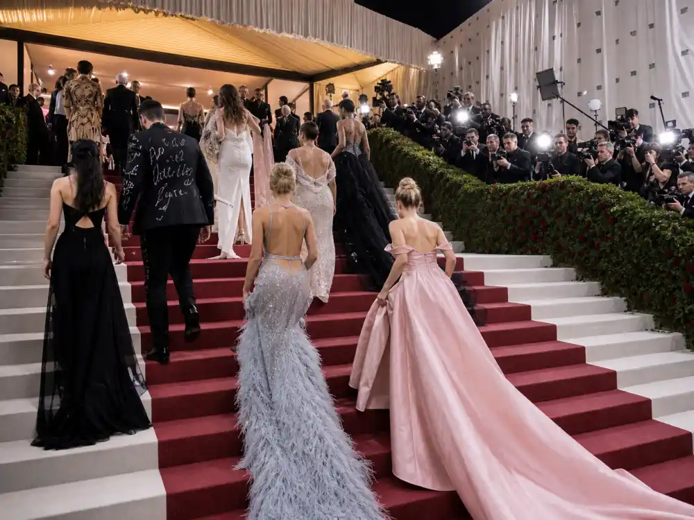 Met Gala red carpet arrivals from Schiaparelli sparkle to Versace fringe illustrating what did Jennifer Lopez wear to Met Gala across years