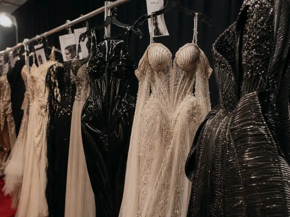 Row of dramatic Met Gala evening gowns illustrating what did Kim Kardashian wear to Met Gala over the years