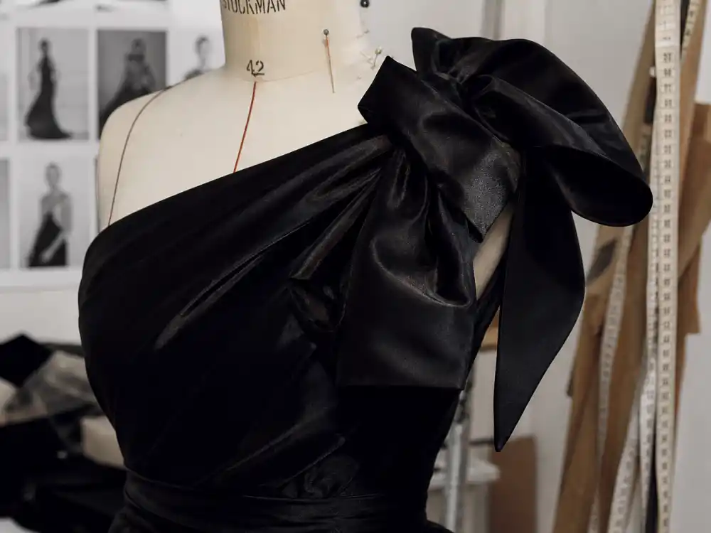Custom black satin couture with oversized bow detail central to what did Lady Gaga wear to Oscars 2019 Brandon Maxwell look
