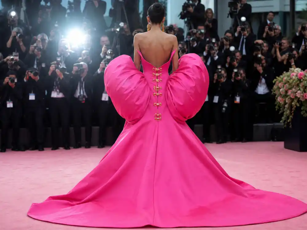 Schiaparelli sculptural pink gown defining what did Margot Robbie wear to Barbie premiere press tour moments