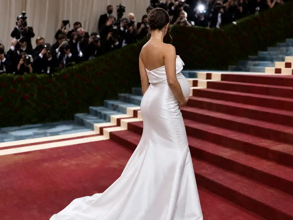 White satin maternity couture on the red carpet reflecting what did Rihanna wear to Met Gala pregnancy reveals