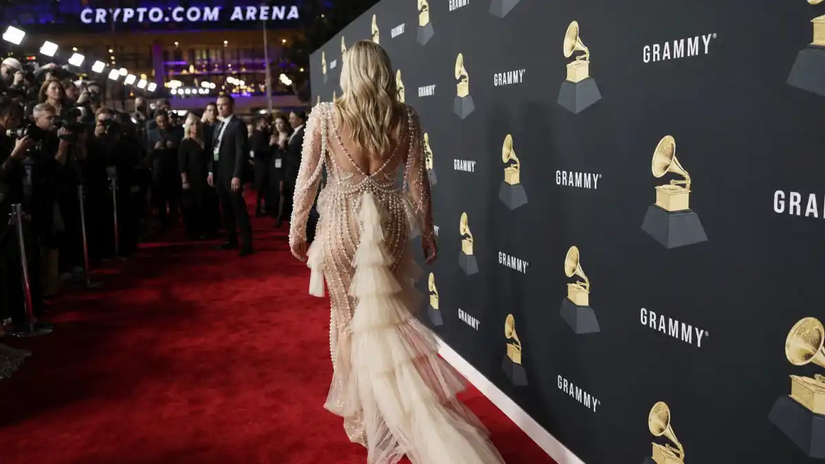 What did Sabrina Carpenter wear to Grammys — ivory pearl-embellished gown on the Grammy Awards red carpet at Crypto.com Arena