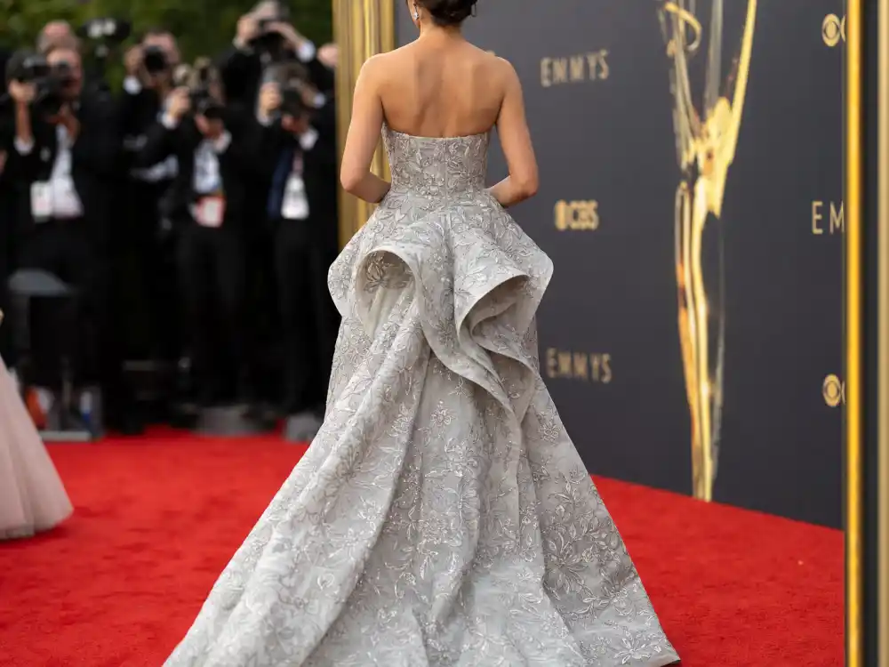 2022 Emmys red carpet bustle train on gray floral Oscar de la Renta gown answering what did Sydney Sweeney wear to Emmys debut arrival