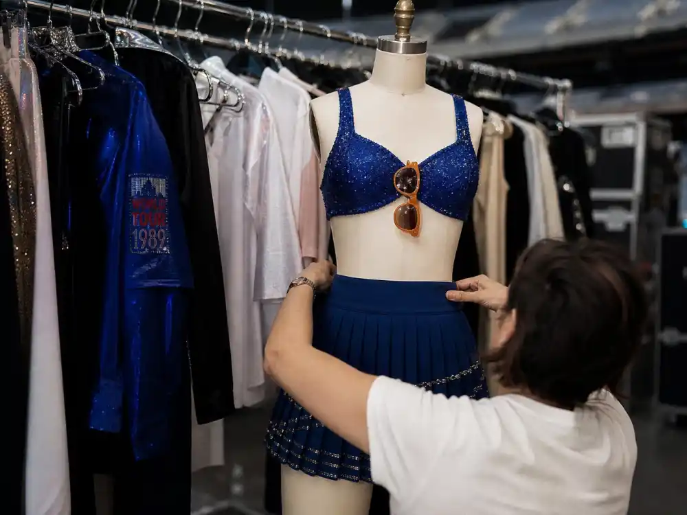 Blue crop top and pleated mini skirt 1989 era look central to what did Taylor Swift wear to Eras Tour pop chapter