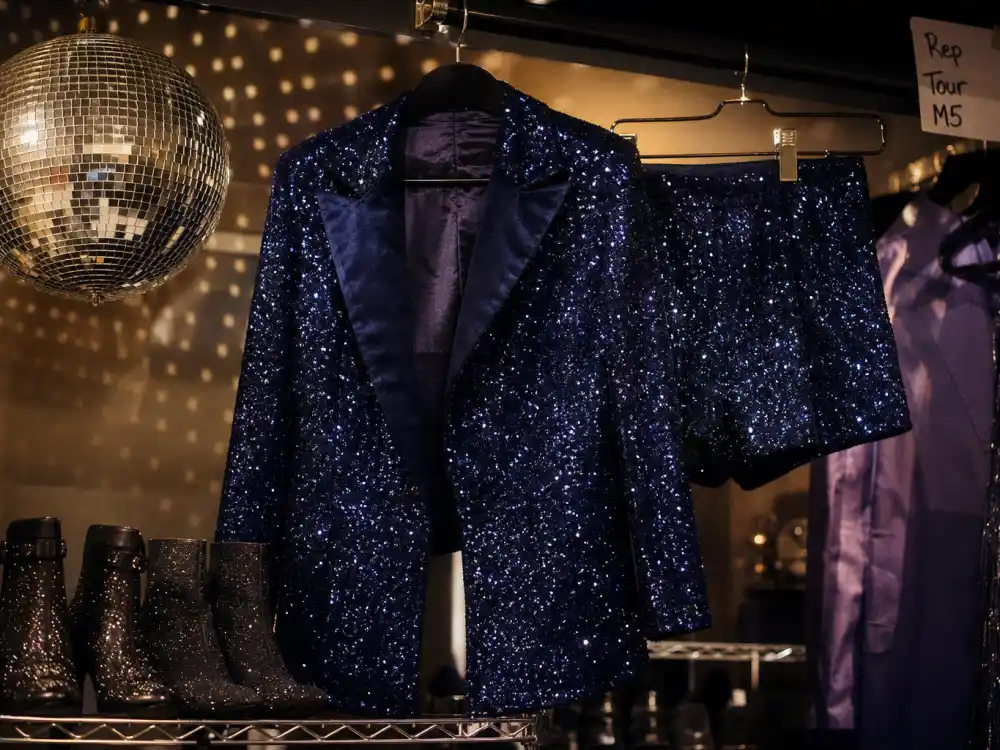 Midnight-blue sequin blazer and shorts reflecting what did Taylor Swift wear to Eras Tour Midnights finale