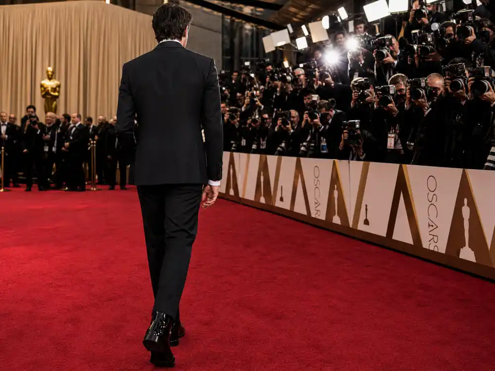 Tom Ford sharp black tuxedo menswear defining what did Timothee Chalamet wear to Oscars afterparty and campaign nights
