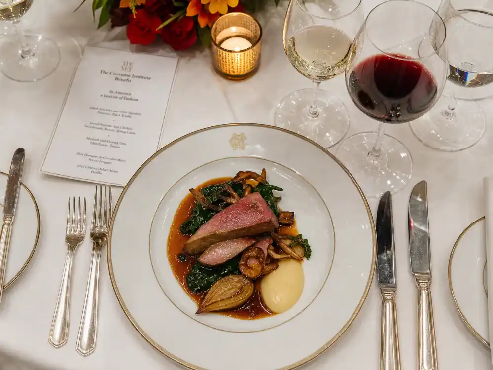 Gourmet plated course at the Met Gala dinner — what happens inside the Met Gala dinner menu features multi-course service from top New York caterers on fine china