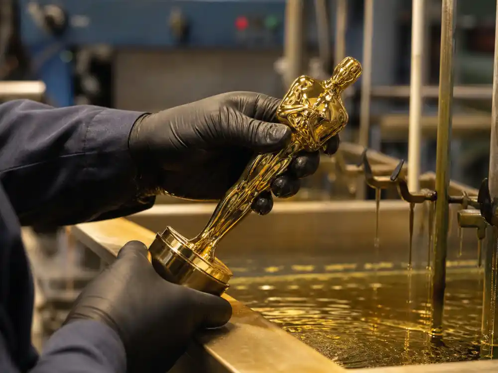 Gold electroplating workshop detail for what is an Oscar statue made of — 24-karat gold finish on generic statuette