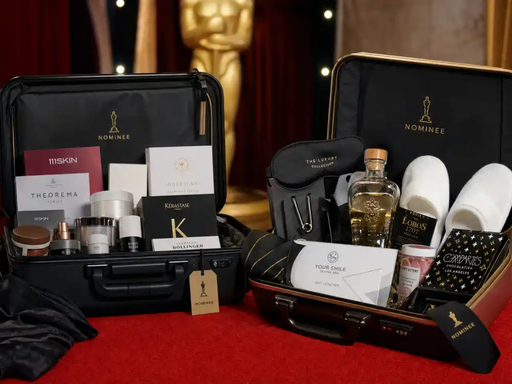 Open rolling suitcases with Oscar nominee swag including skincare, tequila, and spa vouchers — what is in award show gift bags at the Academy Awards is rarely a single tote
