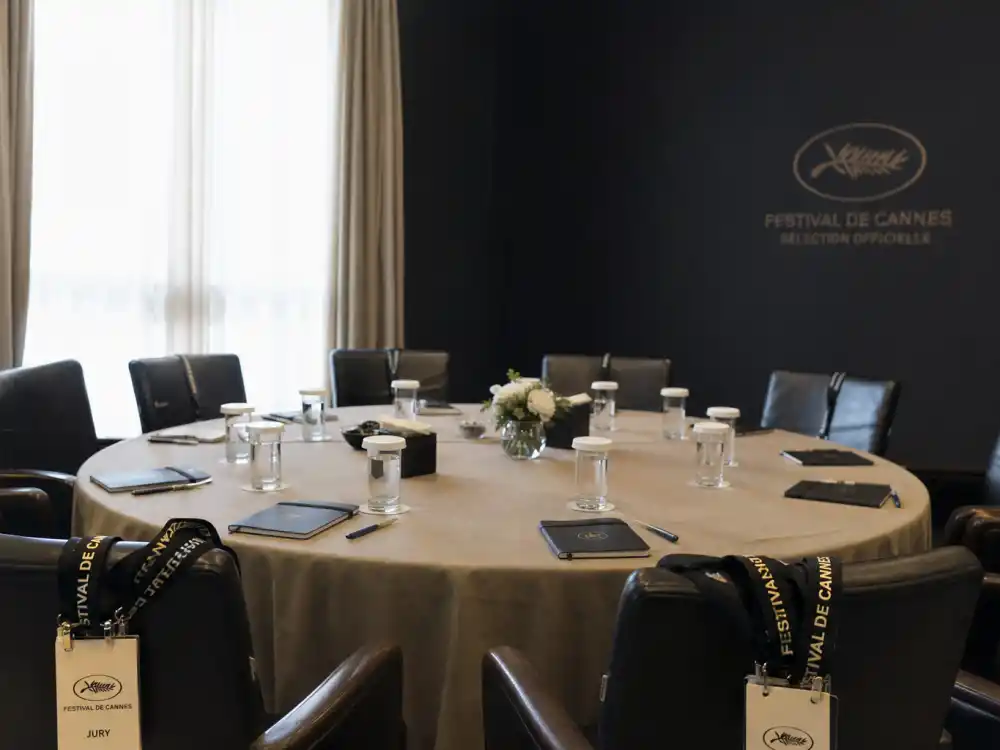 Cannes jury deliberation table symbolizing how what is the Palme d'Or and why it matters voting works each May
