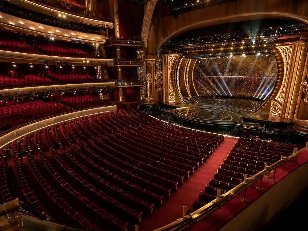 Where are the Oscars held inside the Dolby Theatre auditorium with tiered balconies, red velvet seats, and golden stage spotlights
