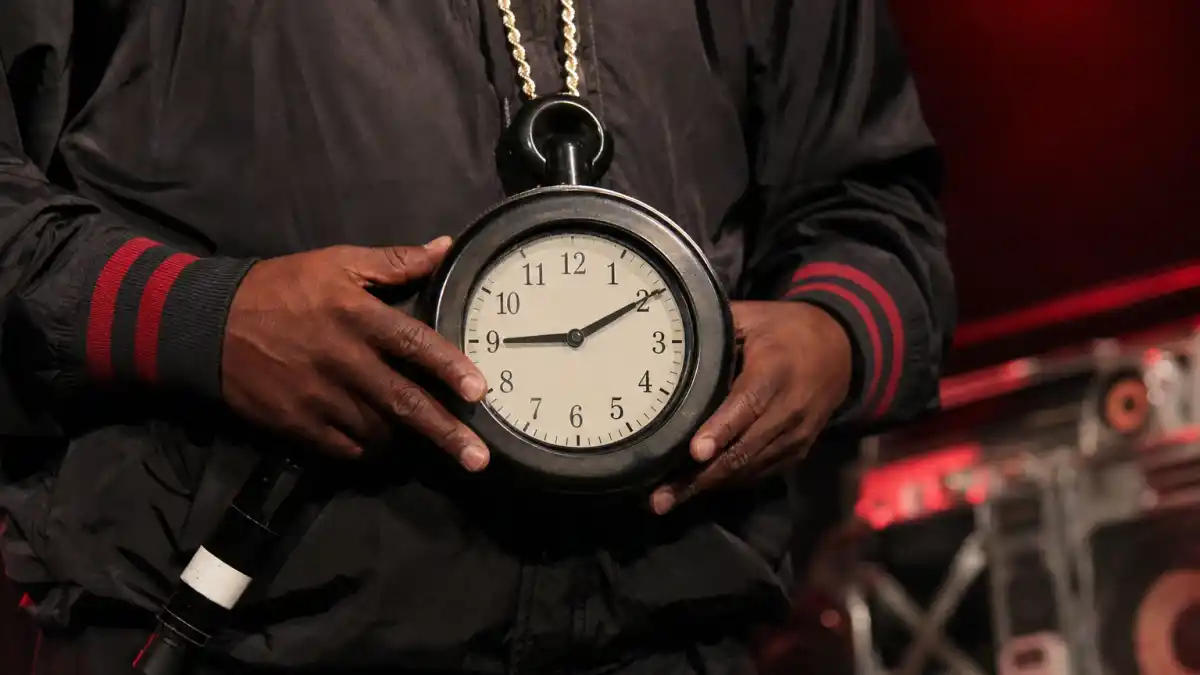 Where is Flavor Flav now — giant Public Enemy clock necklace on stage evoking his hype-man icon era