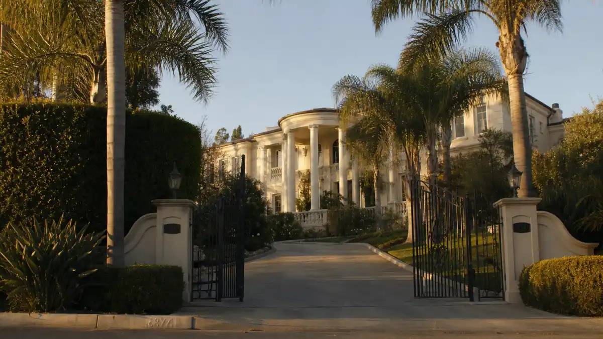 Where is Ross Bagley now — 1990s Bel-Air mansion exterior evoking The Fresh Prince of Bel-Air Nicky Banks era