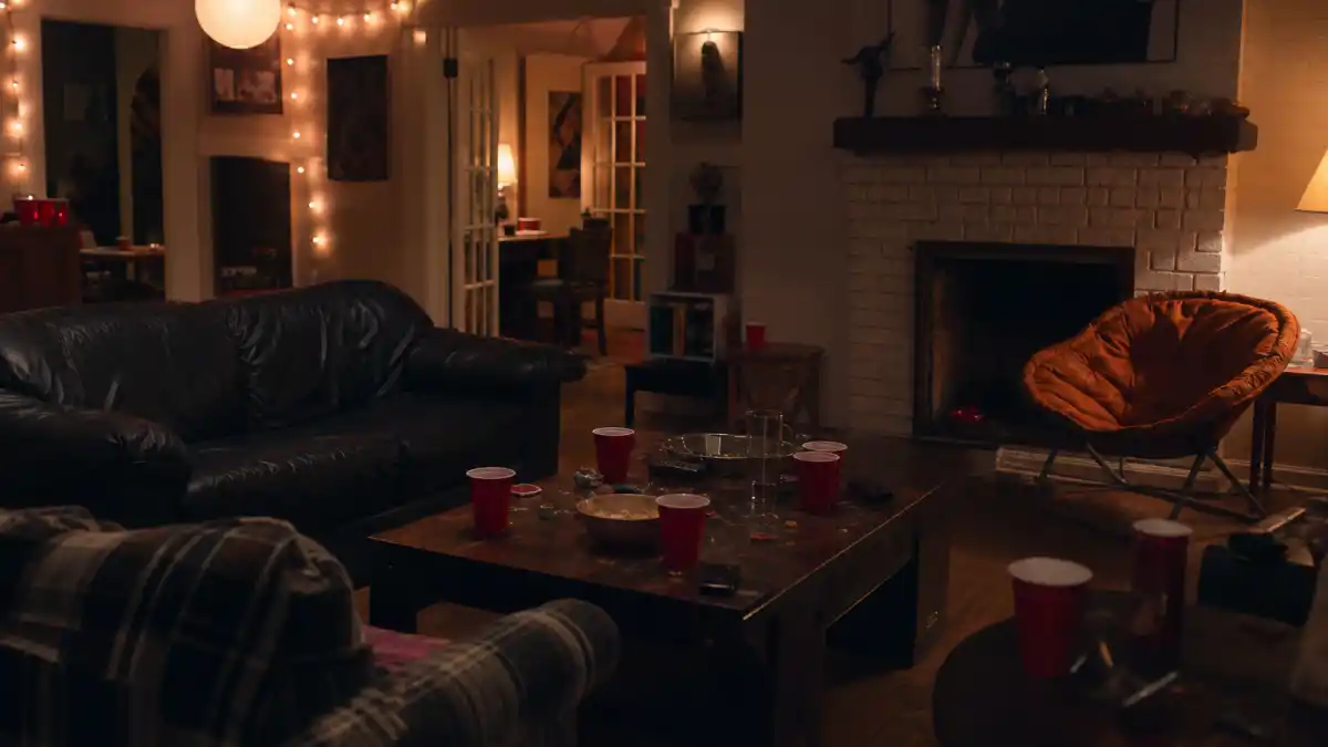 Where is Tara Reid now 2026 — nostalgic teen comedy house party living room with red cups at night