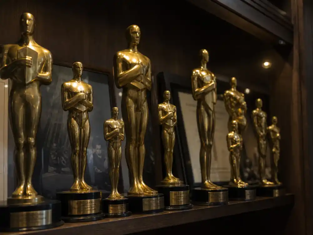 Trophy shelf with multiple golden statuettes symbolizing who has won the most Oscars ever in Academy history
