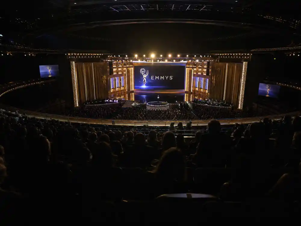 Theatre audience watching the Primetime Emmy Awards as viewers search who is hosting the Emmys 2026 before ceremony night Sept. 14