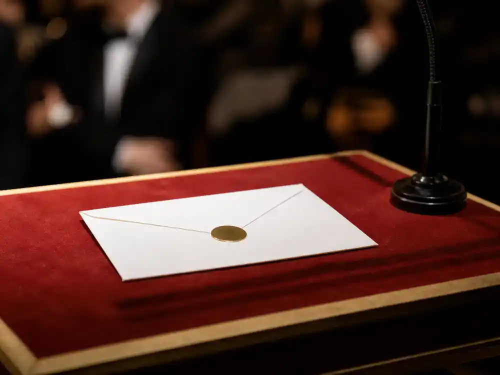 Formal winners envelope on podium during the ceremony where Conan O'Brien hosted after fans searched who is hosting the Oscars 2026