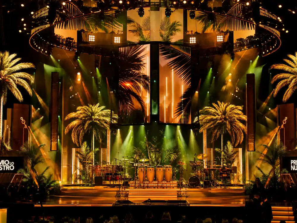 Latin music celebration staging with congas and tropical lights tied to who won album of the year Grammys 2026 historic win