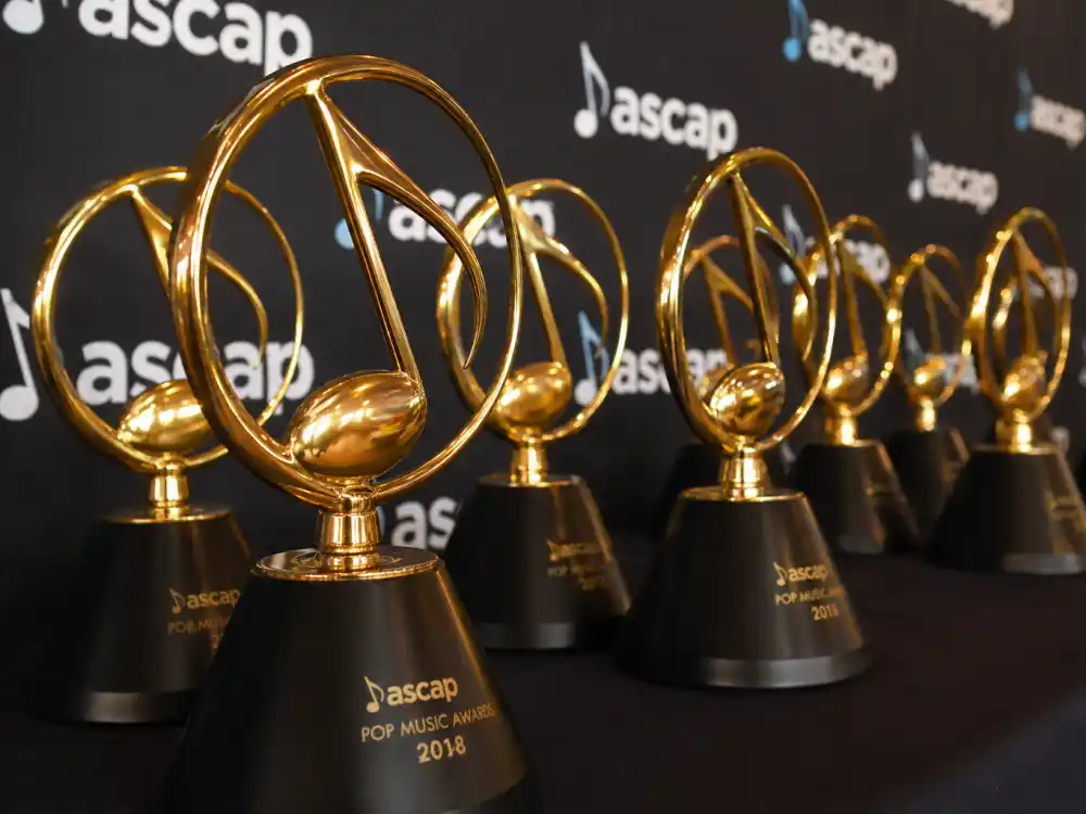 Generic golden music award trophies representing who won album of the year Grammys 2026 Album of the Year prize