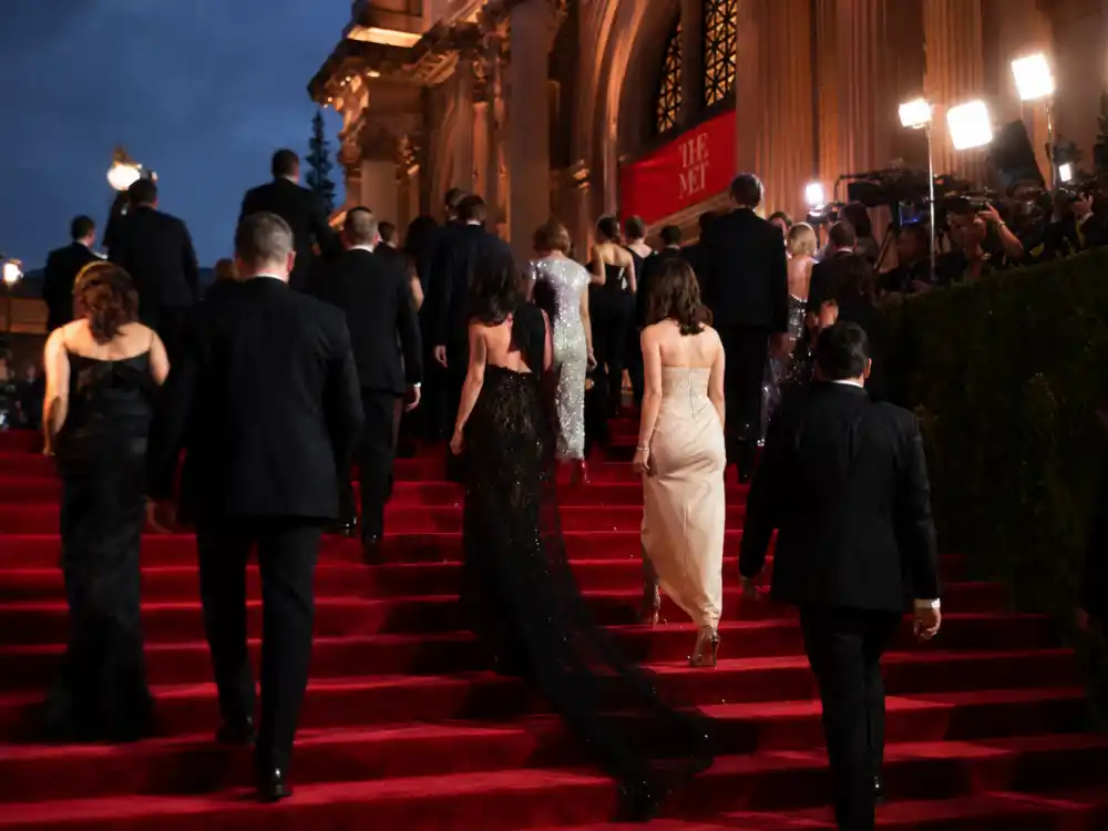 Met Gala red carpet steps at dusk in spring — why is the Met Gala always the first Monday in May ends with this carpet sequence every year except rare postponements