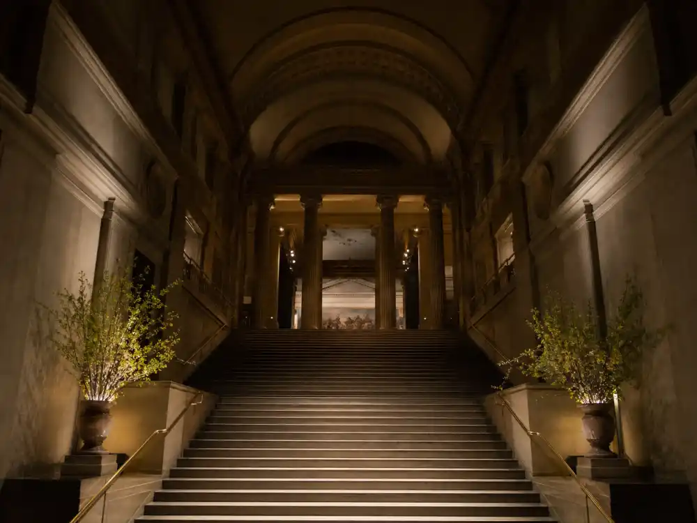 Metropolitan Museum grand staircase in cinematic light — why is the Met Gala always the first Monday in May became pop culture after the Vogue documentary premiere