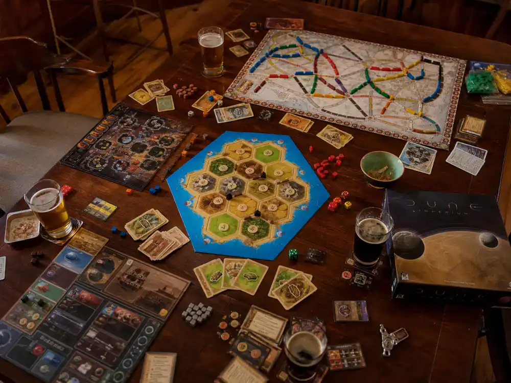A tabletop board game night spread representing Wil Wheaton hosting the TableTop series