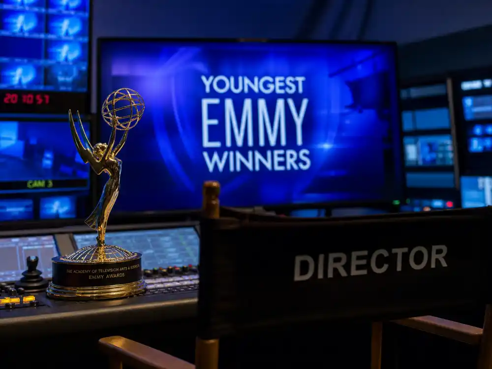 Television studio with Emmy winged statuette for youngest award winners in entertainment history — Roxana Zal at fourteen and Owen Cooper at fifteen