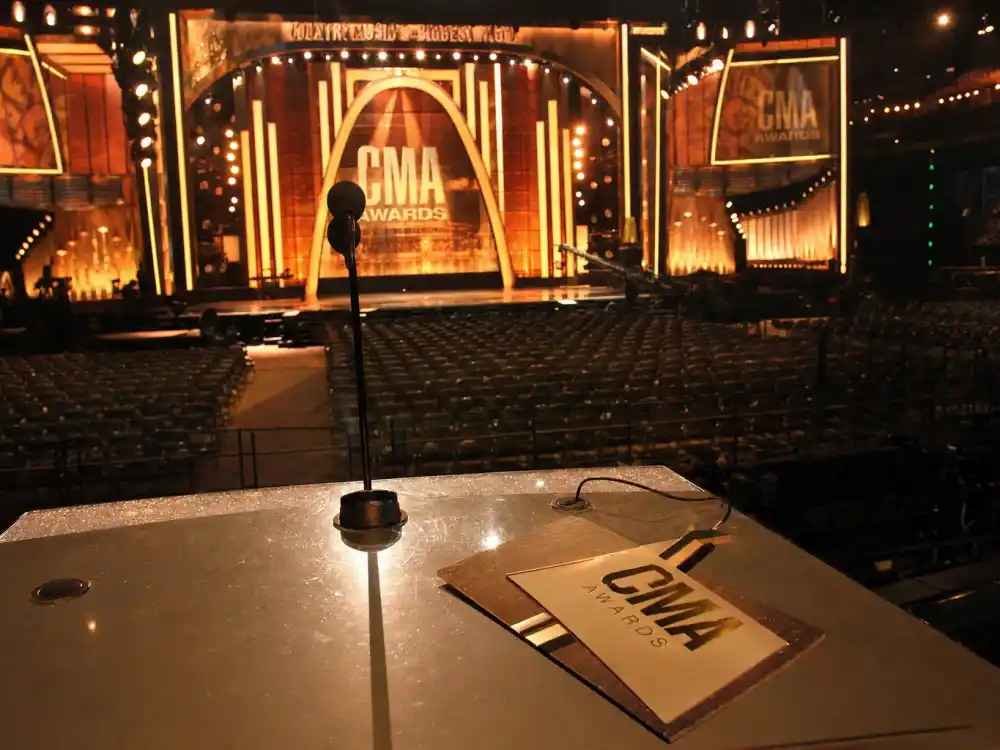 Empty CMA Awards ceremony podium at Nashville arena representing the 2009 night when youngest CMA Entertainer of the Year winners record was set