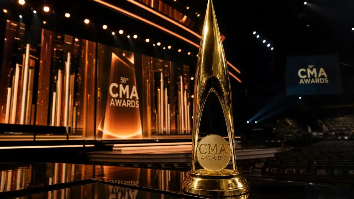 youngest CMA Entertainer of the Year winners — golden Country Music Association trophy on illuminated Nashville awards ceremony stage
