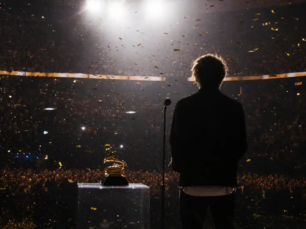 Anonymous teen performer silhouette at a microphone captures the youth behind youngest Grammy winners of all time ceremony moments