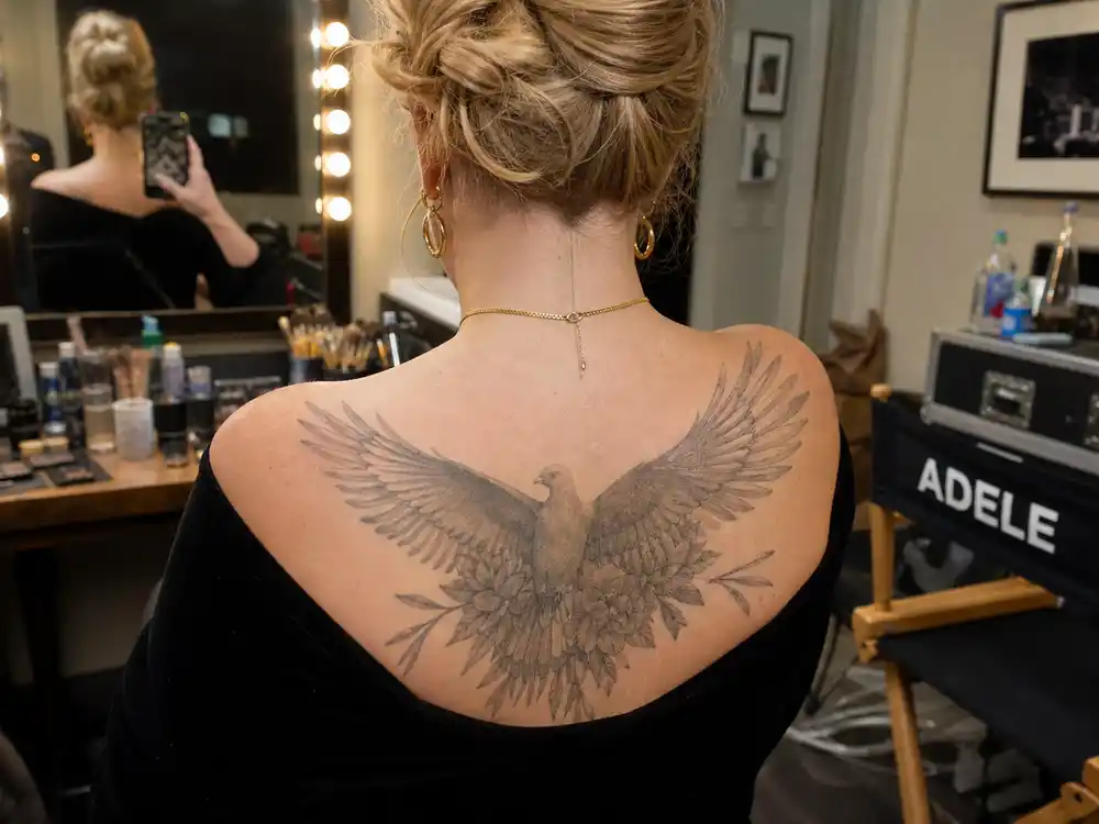 Adele tattoos and their meanings doves — three dove bird tattoos on upper back over-shoulder at recording studio mirror