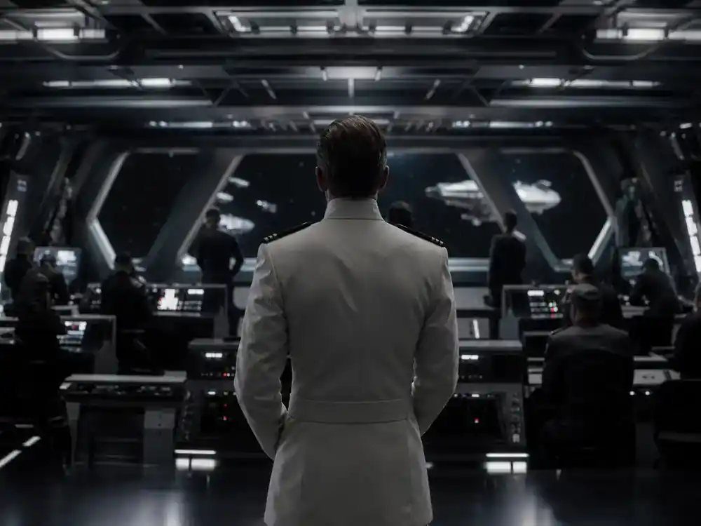 Andor season 2 cast and Star Wars timeline guide Ben Mendelsohn Krennic — Imperial officer silhouette from behind at secret briefing table on sci-fi film set