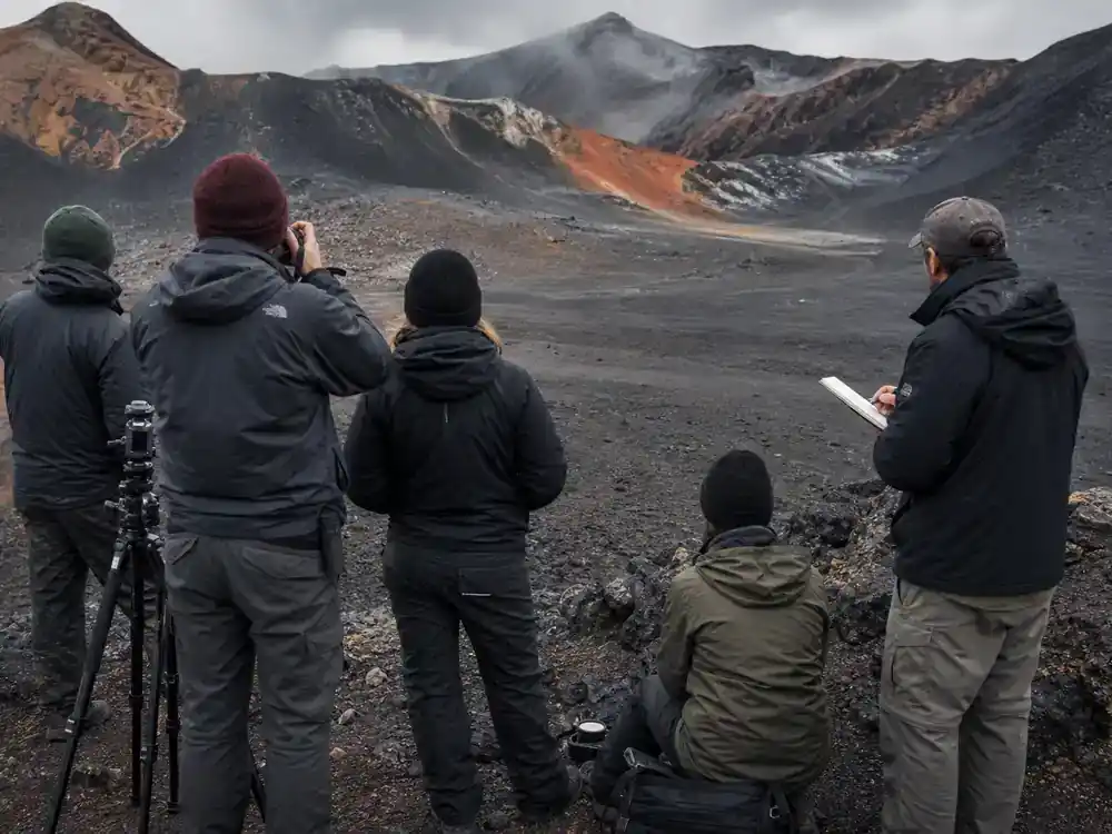 Avatar 3 filming locations and cast updates Fire and Ash — location scouts on volcanic ash terrain with camera equipment and notebooks