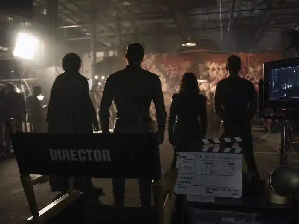 Best TV finales of 2026 ranked so far The Boys — actor silhouettes from behind on dark superhero TV drama film set with director chair and clapperboard